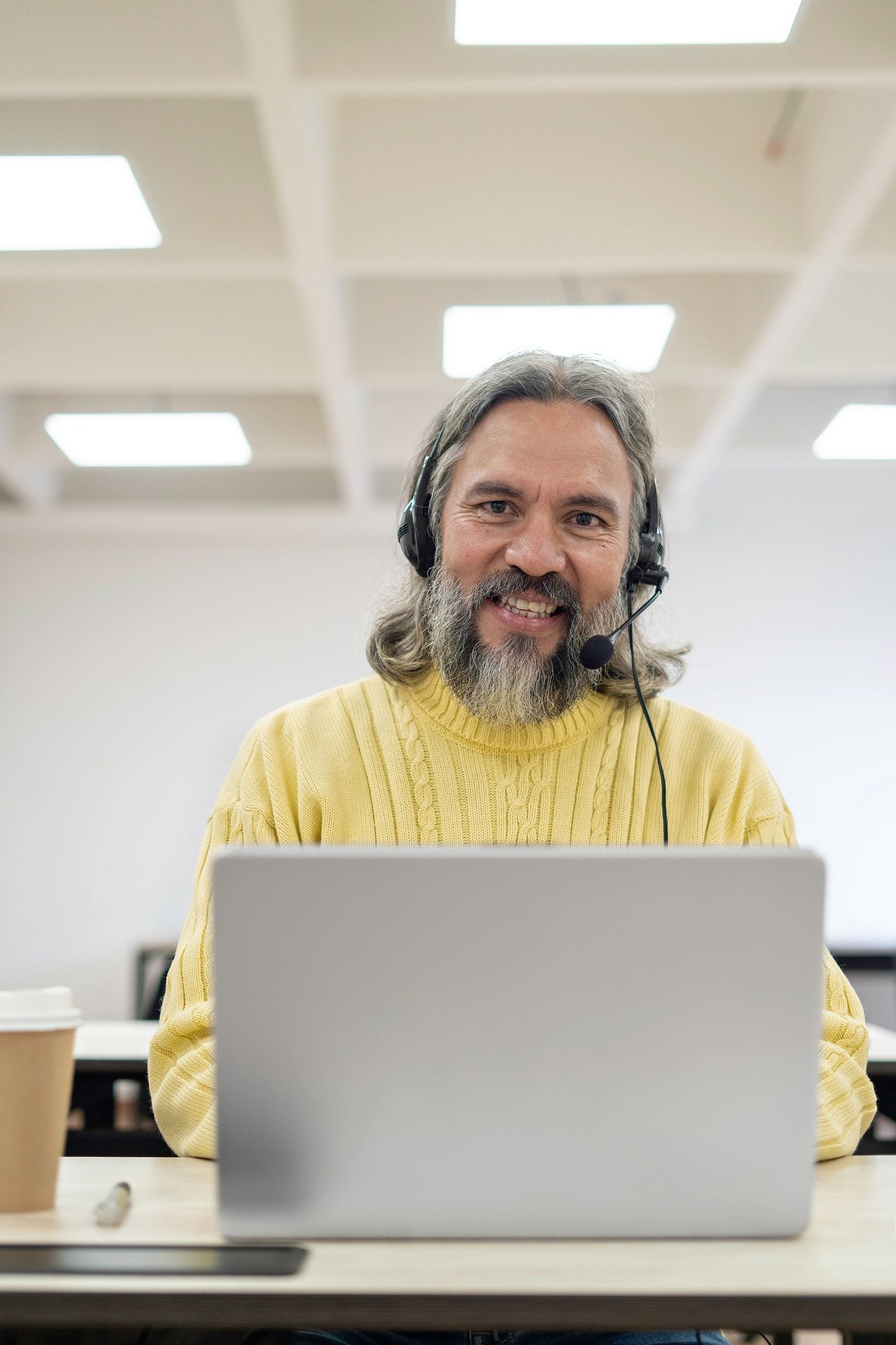Customer service professional in an office with headset